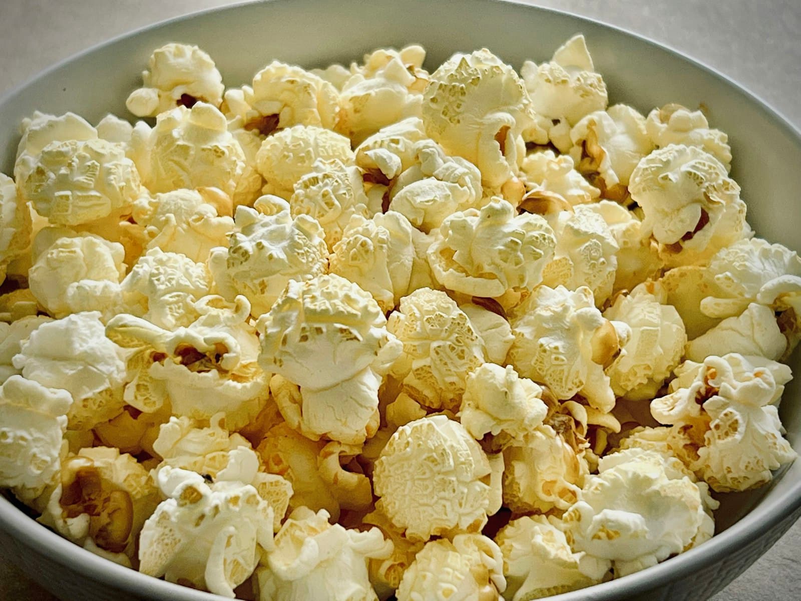 Buttery popcorn in a bowl, close up